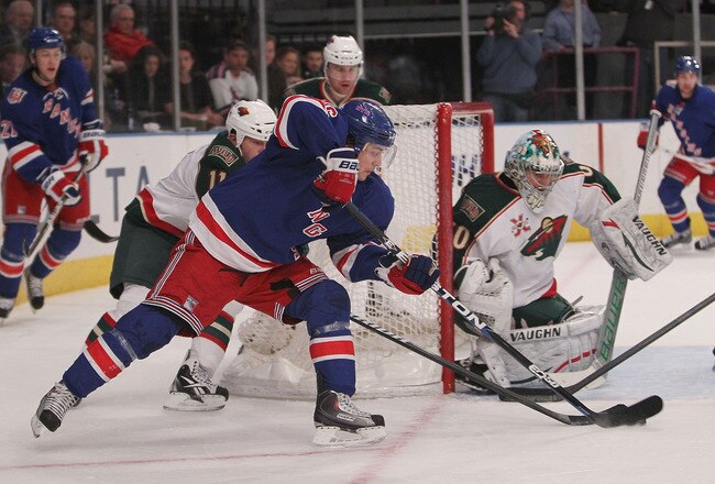 NEW YORK, NY - MARCH 03: Mats Zuccarello #36 of the New York Rangers has his backhanded shot saved by Jose Theodore #60 of the Minnesota Wild at Madison Square Garden on March 3, 2011 in New York City.  (Photo by Nick Laham/Getty Images)