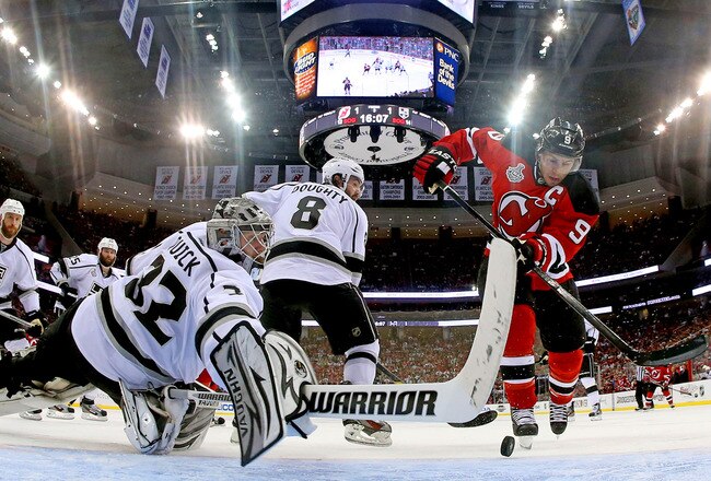 NEWARK, NJ - MAY 30:  Jonathan Quick #32 of the Los Angeles Kings makes a save against Zach Parise #9 of the New Jersey Devils during Game One of the 2012 NHL Stanley Cup Final at the Prudential Center on May 30, 2012 in Newark, New Jersey.  (Photo by Bruce Bennett/Getty Images)