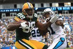CHARLOTTE, NC - SEPTEMBER 18:   Jermichael Finley #88 of the Green Bay Packers tries to make a catch against Captain Munnerlyn #41 of the Carolina Panthers during their game at Bank of America Stadium on September 18, 2011 in Charlotte, North Carolina.  (Photo by Streeter Lecka/Getty Images)
