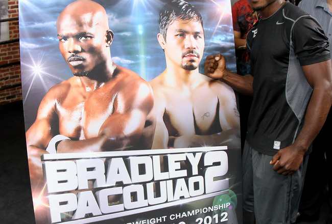 LOS ANGELES, CA - MAY 29:  Timothy Bradley stands in front of a placard advertising Bradley Paquiao 2, which would happen if he wins their upcoming fight in June, at a media workout  at Fortune Gym on May 29, 2012 in Los Angeles, California.  The workout is in advance of Bradley's upcoming WBO welterweight championship fight against Manny Pacquiao on June 9 at the MGM Grand in Las Vegas.  (Photo by Stephen Dunn/Getty Images)