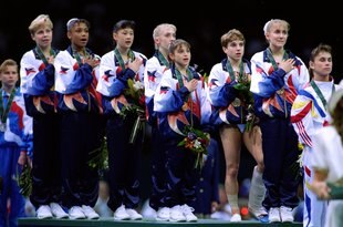 23 Jul 1996: Kerri Strug of the USA stands with a hurt ankle for the National Anthem during the awards ceremony at the Georgia Dome in the 1996 Olympic Games in Atlanta, Georgia. Mandatory Credit: Mike Powell  /Allsport