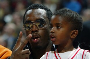 ATLANTA, GA - FEBRUARY 9:  Rapper Sean 'P. Diddy' Combs and his son Justin watch the 2003 NBA All-Star Game on February 9, 2003 at Philips Arena in Atlanta, Georgia.  NOTE TO USER:  User expressly acknowledges and agrees that, by downloading and or using this photograph, user is consenting to the terms and conditions of the Getty Images license agreement. (Photo by Jed Jacobsohn/Getty Images)