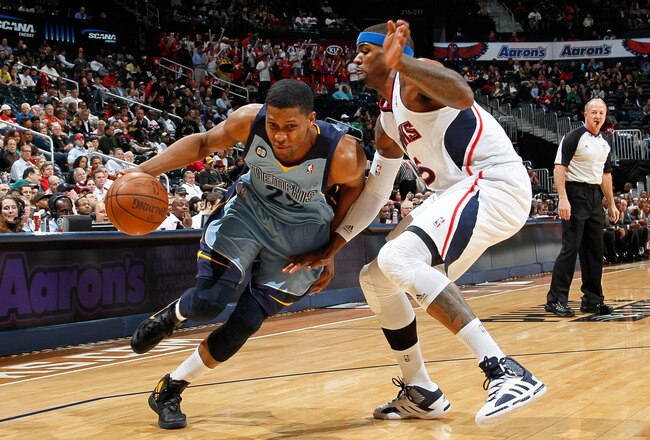 ATLANTA, GA - FEBRUARY 02:  Rudy Gay #22 of the Memphis Grizzlies drives around Josh Smith #5 of the Atlanta Hawks at Philips Arena on February 2, 2012 in Atlanta, Georgia.  NOTE TO USER: User expressly acknowledges and agrees that, by downloading and or using this photograph, User is consenting to the terms and conditions of the Getty Images License Agreement.  (Photo by Kevin C. Cox/Getty Images)