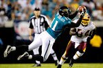 JACKSONVILLE, FL - SEPTEMBER 03:  Mike Sims-Walker #11 of the Jacksonville Jaguars makes a reception during the game against the Washington Redskins at Jacksonville Municipal Stadium on September 3, 2009 in Jacksonville, Florida.  (Photo by Sam Greenwood/Getty Images)
