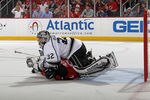 NEWARK, NJ - MAY 30:  Zach Parise #9 of the New Jersey Devils collides with Jonathan Quick #32 of the Los Angeles Kings during Game One of the 2012 NHL Stanley Cup Final at the Prudential Center on May 30, 2012 in Newark, New Jersey.  (Photo by Bruce Bennett/Getty Images)