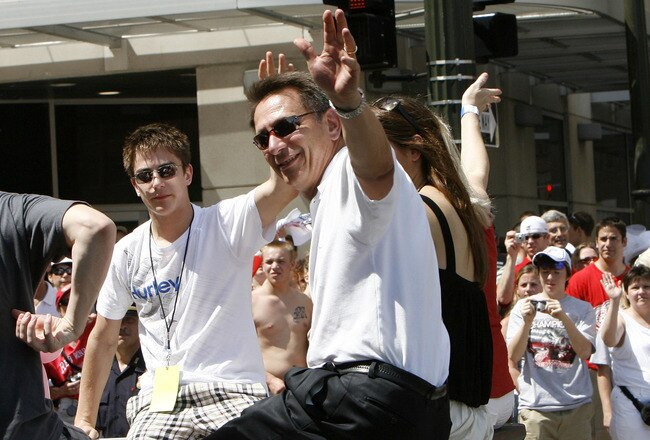 DETROIT - JUNE 06:  Ken Holland general manager of the Detroit Red Wings reacts to fans during a parade to celebrate winning the 2008 Stanley Cup on June 6, 2008 in Detroit, Michigan.  (Photo by Gregory Shamus/Getty Images)