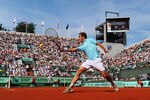 PARIS, FRANCE - JUNE 02:  Richard Gasquet of France plays a backhand during his men's singles third round match against Tommy Haas of Germany during day seven of the French Open at Roland Garros on June 2, 2012 in Paris, France.  (Photo by Mike Hewitt/Getty Images)