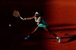 PARIS, FRANCE - MAY 29:  Serena Williams of USA plays a forehand in her women's singles first round match between Serena Williams of USA and Virginie Razzano of France during day three of the French Open at Roland Garros on May 29, 2012 in Paris, France.  (Photo by Mike Hewitt/Getty Images)