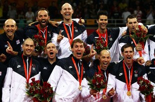 BEIJING - AUGUST 24:  United States players and coach Hugh McCutcheon celebrate victory in the Gold Medal volleyball match between the United States and Brazil held at the Capital Indoor Stadium during Day 16 of the Beijing 2008 Olympic Games on August 24, 2008 in Beijing, China.  (Photo by Jonathan Ferrey/Getty Images)
