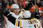 PHILADELPHIA, PA - JANUARY 22:  Gregory Campbell #11 of the Boston Bruins celebrates his third period goal against the Philadelphia Flyers with teammate Daniel Paille #20 on January 22, 2012 at Wells Fargo Center in Philadelphia, Pennsylvania. The Bruins defeated the Flyers 6-5 after a shootout.  (Photo by Jim McIsaac/Getty Images)