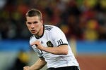 DURBAN, SOUTH AFRICA - JULY 07:  Lukas Podolski of Germany passes the ball during the 2010 FIFA World Cup South Africa Semi Final match between Germany and Spain at Durban Stadium on July 7, 2010 in Durban, South Africa.  (Photo by Clive Mason/Getty Images)