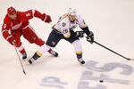 DETROIT, MI - APRIL 15: Ryan Suter #20 of the Nashville Predators tries to get around the stick of Nicklas Lidstrom #5 of the Detroit Red Wings during Game Three of the Western Conference Quarterfinals during the 2012 NHL Stanley Cup Playoffs at Joe Louis Arena on April 15, 2012 in Detroit, Michigan. Nashville won the game 3-2 and lead the series 2-1. (Photo by Gregory Shamus/Getty Images)