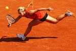 PARIS, FRANCE - MAY 28:  Dominika Cibulkova of Slovakia stretches to hit a forehand in the women's singles first round match between Kristina Mladenovic of France and Dominika Cibulkova of Slovakia during day two of the French Open at Roland Garros on May 28, 2012 in Paris, France.  (Photo by Clive Brunskill/Getty Images)