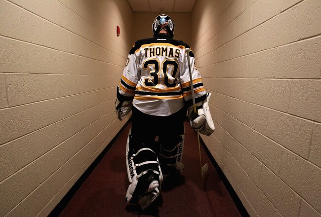 GLENDALE, AZ - DECEMBER 28:  Goaltender Tim Thomas #30 of the Boston Bruins walks back to the locker room before the NHL game against the Phoenix Coyotes at Jobing.com Arena on December 28, 2011 in Glendale, Arizona.  (Photo by Christian Petersen/Getty Images)