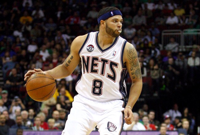 NEWARK, NJ - APRIL 14:  Deron Williams #8 of the New Jersey Nets looks to pass the ball against the Boston Celtics at Prudential Center on April 14, 2012 in Newark, New Jersey. NOTE TO USER: User expressly acknowledges and agrees that, by downloading and or using this photograph, User is consenting to the terms and conditions of the Getty Images License Agreement.  (Photo by Chris Chambers/Getty Images)