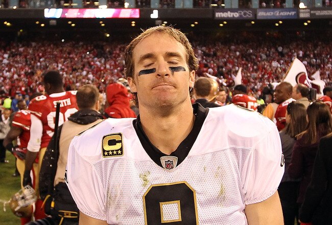 SAN FRANCISCO, CA - JANUARY 14:  Drew Brees #9 of the New Orleans Saints reacts after they lost their game against the the San Francisco 49ers in the NFC Divisional playoff game at Candlestick Park on January 14, 2012 in San Francisco, California.  (Photo by Ezra Shaw/Getty Images)