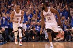 OKLAHOMA CITY, OK - MAY 31:  (R-L) James Harden #13 reacts after making a three-pointer alongside teammate Russell Westbrook #0 of the Oklahoma City Thunder in the first half against the San Antonio Spurs in Game Three of the Western Conference Finals of the 2012 NBA Playoffs at Chesapeake Energy Arena on May 31, 2012 in Oklahoma City, Oklahoma. NOTE TO USER: User expressly acknowledges and agrees that, by downloading and or using this photograph, User is consenting to the terms and conditions of the Getty Images License Agreement.  (Photo by Ronald Martinez/Getty Images)