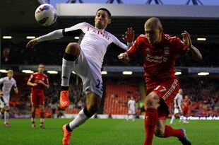 LIVERPOOL, ENGLAND - MAY 01:  Martin Skrtel of Liverpool competes with Clint Dempsey of Fulham during the Barclays Premier League match between Liverpool and Fulham at Anfield on May 1, 2012 in Liverpool, England.  (Photo by Clive Brunskill/Getty Images)