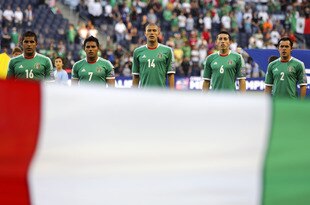 KANSAS CITY, KS - APRIL 2:  Members of Mexico sing the the National Anthem before a game against Honduras in the 2012 CONCACAF Men's Olympic Qualifying Finals at Livestrong Sporting Park on April 2, 2012 in Kansas City, Kansas. (Photo by Ed Zurga/Getty Images)