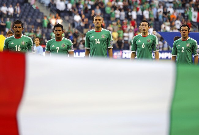 KANSAS CITY, KS - APRIL 2:  Members of Mexico sing the the National Anthem before a game against Honduras in the 2012 CONCACAF Men's Olympic Qualifying Finals at Livestrong Sporting Park on April 2, 2012 in Kansas City, Kansas. (Photo by Ed Zurga/Getty Images)
