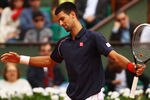 PARIS, FRANCE - JUNE 03:  Novak Djokovic of Serbia shows his frustration in his men's singles fourth round match against Andreas Seppi of Italy during day 8 of the French Open at Roland Garros on June 3, 2012 in Paris, France.  (Photo by Clive Brunskill/Getty Images)