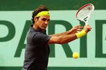 PARIS, FRANCE - JUNE 03:  Roger Federer of Switzerland plays a backhand in his men's singles fourth round match against David Goffin of Belgium during day 8 of the French Open at Roland Garros on June 3, 2012 in Paris, France.  (Photo by Matthew Stockman/Getty Images)