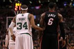BOSTON, MA - JUNE 01:  (L-R) Paul Pierce #34 of the Boston Celtics and LeBron James #6 of the Miami Heat stand on court in Game Three of the Eastern Conference Finals in the 2012 NBA Playoffs on June 1, 2012 at TD Garden in Boston, Massachusetts.  NOTE TO USER: User expressly acknowledges and agrees that, by downloading and or using this photograph, User is consenting to the terms and conditions of the Getty Images License Agreement.  (Photo by Jim Rogash/Getty Images)