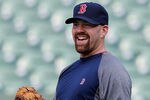 BALTIMORE, MD - MAY 22:  Kevin Youkilis #20 of the Boston Red Sox laughs while warming up before the start of the Red Sox game against the Baltimore Orioles at Oriole Park at Camden Yards on May 22, 2012 in Baltimore, Maryland.  (Photo by Rob Carr/Getty Images)