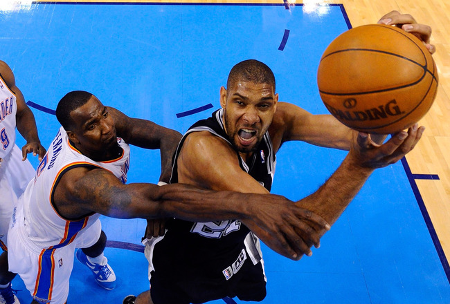 OKLAHOMA CITY, OK - JUNE 02: Tim Duncan #21 of the San Antonio Spurs looks to shoot over Kendrick Perkins #5 of the Oklahoma City Thunder in the second half in Game Four of the Western Conference Finals of the 2012 NBA Playoffs at Chesapeake Energy Arena on June 2, 2012 in Oklahoma City, Oklahoma. NOTE TO USER: User expressly acknowledges and agrees that, by downloading and or using this photograph, User is consenting to the terms and conditions of the Getty Images License Agreement. (Photo by Larry W. Smith/Pool/Getty Images)