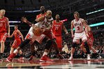 CHICAGO, IL - APRIL 02: Taj Gibson #22 of the Chicago Bulls tries to shoot against patirck Patterson #54 of the Houston Rockets as Marcus Camby #29 and Omer Asik #3 watch at the United Center on April 2, 2012 in Chicago, Illinois. The Rockets defeated the Bulls 99-93. NOTE TO USER: User expressly acknowledges and agrees that, by downloading and or using this photograph, User is consenting to the terms and conditions of the Getty Images License Agreement. (Photo by Jonathan Daniel/Getty Images)