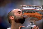 6 Jun 1999:  Andre Agassi of the USA kisses the trophy after victory in the 1999 French Open Final match at Roland Garros in Paris, France.   \ Mandatory Credit: Al Bello /Allsport