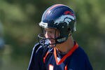 ENGLEWOOD, CO - MAY 21:  Quarterback Peyton Manning #18 of the Denver Broncos hands the ball off during organized team activities at Dove Valley on May 21, 2012 in Englewood, Colorado. (Photo by Justin Edmonds/Getty Images)