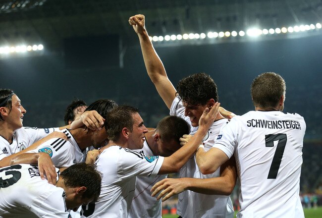 L'VIV, UKRAINE - JUNE 09:  Mario Gomez of Germany celebrates scoring their first goal with his team mates during the UEFA EURO 2012 group B match between Germany and Portugal at Arena Lviv on June 9, 2012 in L'viv, Ukraine.  (Photo by Joern Pollex/Getty Images)