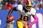 EAST RUTHERFORD, NJ - OCTOBER 21: Quarterback Robert Griffin III #10 of the Washington Redskins runs against the New York Giants during their game at MetLife Stadium on October 21, 2012 in East Rutherford, New Jersey.  (Photo by Alex Trautwig/Getty Images)