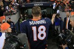 DENVER, CO - NOVEMBER 18:  Quarterback Peyton Manning #18 of the Denver Broncos tosses his wrist bands to the fans as he leaves the field after facing the San Diego Chargers at Sports Authority Field at Mile High on November 18, 2012 in Denver, Colorado. The Broncos defeated the Chargers 30-23.  (Photo by Doug Pensinger/Getty Images)