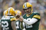 GREEN BAY, WI - DECEMBER 2:  Aaron Rodgers #12 of the Green Bay Packers signals to the official for a hold during a game against the Minnesota Vikings at Lambeau Field on December 2, 2012 in Green Bay, Wisconsin.  The Packers defeated the Vikings 23-14.  (Photo by Wesley Hitt/Getty Images)