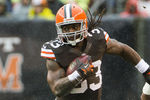 CLEVELAND, OH - OCTOBER 28: Running back Trent Richardson #33 of the Cleveland Browns runs for a gain under pressure from cornerback Antoine Cason #20 of the San Diego Chargers during the first half at Cleveland Browns Stadium on October 28, 2012 in Cleveland, Ohio. (Photo by Jason Miller/Getty Images)