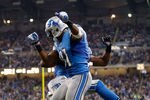 DETROIT, MI - NOVEMBER 22:  Calvin Johnson #81 of the Detroit Lions celebrates a second quarter touchdown with Ryan Broyles #84 while playing the Houston Texans at Ford Field on November 22, 2012 in Detroit, Michigan. (Photo by Gregory Shamus/Getty Images)