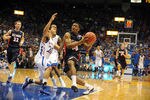 Dec 15, 2012; Lawrence, KS, USA; Kansas Jayhawks guard Niko Roberts (20) fouls Belmont Bruins guard Adam Barnes (24) in the second half at Allen Fieldhouse. Kansas won the game 89-60. Mandatory Credit: John Rieger-USA TODAY Sports