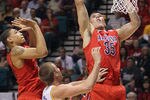 LAS VEGAS, NV - MARCH 15:  Kaleb Tarczewki #35 of the Arizona Wildcats goes up for a rebound past Travis Wear #24 of the UCLA Bruins in the first half during the semifinals of the Pac 12 Basketball Tournament at the MGM Grand Garden Arena on March 15, 2013 in Las Vegas, Nevada. UCLA defeated Arizona 66-64.  (Photo by Jeff Gross/Getty Images)