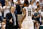 EAST LANSING, MI - MARCH 07:  Head coach Tom Izzo of the Michigan State Spartans congratulates Keith Appling #11 as he leaves the floor in the second half while playing the Wisconsin Badgers at the Jack T. Breslin Student Events Center on March 7, 2013 in East Lansing, Michigan. Michigan State won the game 58-43. (Photo by Gregory Shamus/Getty Images)