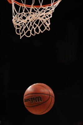 OKLAHOMA CITY - MARCH 12:  A detail shot of a basketball falling through baket during the Phillips 66 Big 12 Men's Basketball Championship at the Ford Center March 12, 2009 in Oklahoma City, Oklahoma.  (Photo by Ronald Martinez/Getty Images)