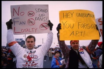19 Nov 1995: Fans hold various signs which accuses Cleveland Browns owner Art Modell of disregard of fans at Cleveland Stadium in Cleveland, Ohio. The Packers defeated the Browns that day 31-20.