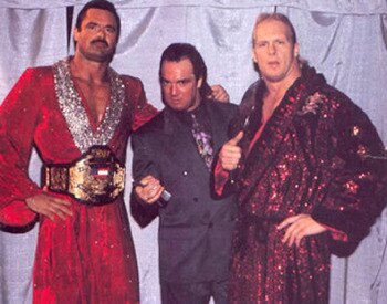 Paul E. Dangerously (c) pictured here with Rick Rude and Steve Austin