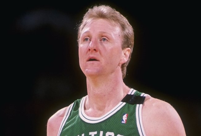 Forward Larry Bird of the Boston Celtics stands on the court during a game.