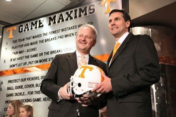Derek-dooley-and-mike-hamilton-hold-a-tennessee-vol-helmet-on-friday-evening-putting-an-end-to-one-of-the-most-tumultuous-weeks-in-vol-history-photo-by-adam-brimer2_display_image