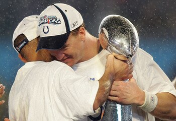 MIAMI GARDENS, FL - FEBRUARY 04:  Super Bowl MVP Peyton Manning #18 of the Indianapolis Colts hugs head coach Tony Dungy as he celebrates with the Vince Lombardi Trophy after the Colts 29-17 win against the Chicago Bears in Super Bowl XLI on February 4, 2