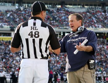 FOXBORO, MA - OCTOBER 04:  Head coach Bill Belichick of the New England Patriots discusses a call with the head linesman in the fourth quarter against the Baltimore Ravens on October 4, 2009 at Gillette Stadium in Foxboro, Massachusetts. The Patriots defe