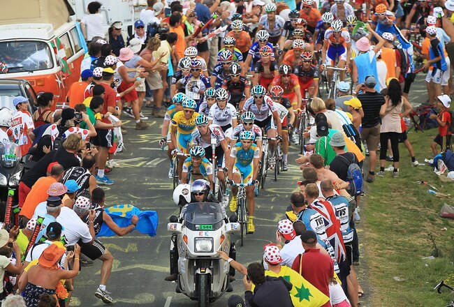 PAU, FRANCE - JULY 20: Thousands cheer on the peloton as they come to the top of the Col du Tourmalet during stage 16 of the Tour de France on July 20, 2010 in Pau, France. The stage, between Bagneres-de-Luchon and Pau, featured four major climbs includin