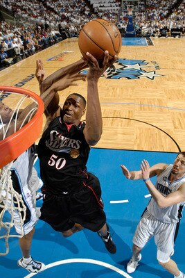 Theo-ratliff-of-the-76ers-makes-the-dunk-over-the-defensive-presence-of-the-magics-hedo-turkoglu-and-tony-battie_display_image